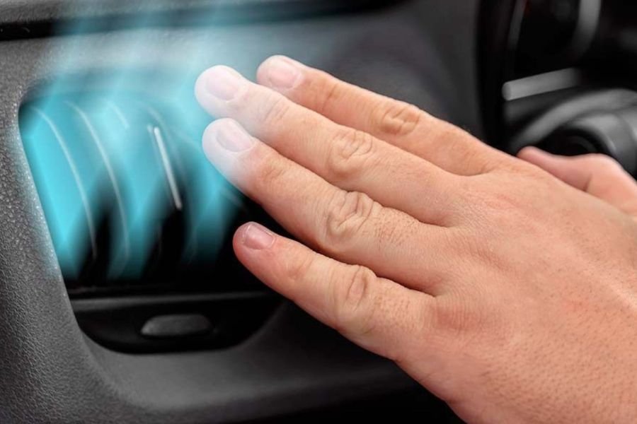 A man showing his car AC is not cooling properly